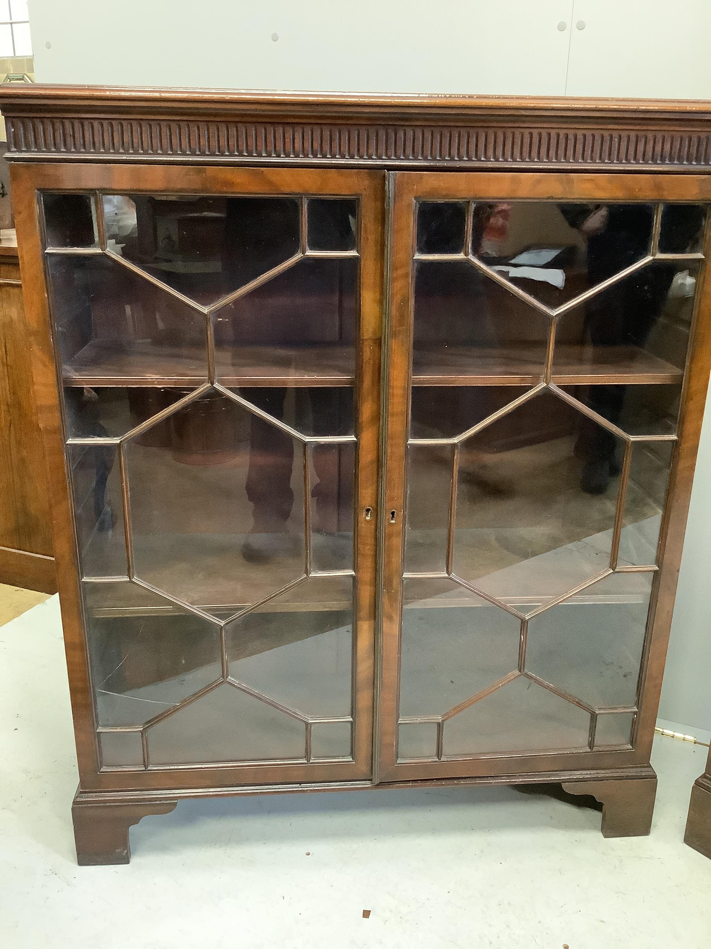 A pair of Chippendale Revival mahogany dwarf bookcases, each 97cm, depth 34cm, height 119cm